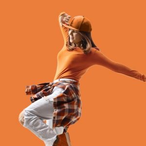 NAFS In Person Plus Program | Dancer on orange background