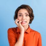 NAFS - National Arts Fundraising School - Anxious woman against a blue background - case for support