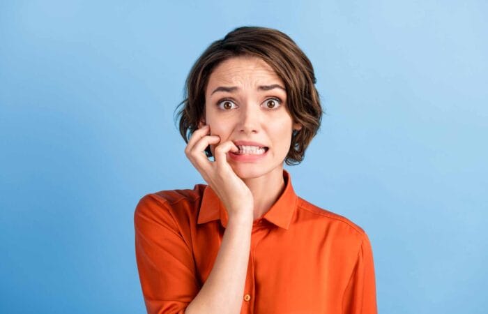 NAFS - National Arts Fundraising School - Anxious woman against a blue background - case for support