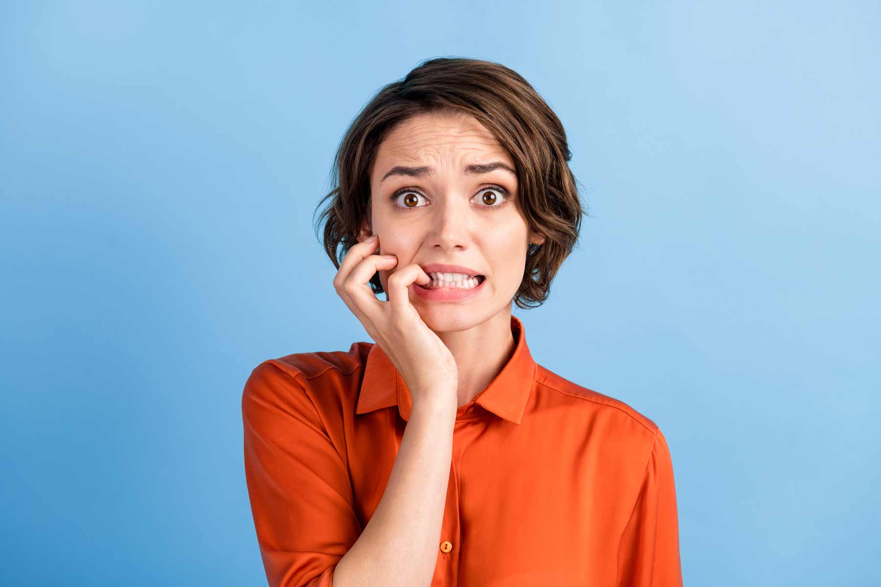 NAFS - National Arts Fundraising School - Anxious woman against a blue background - case for support